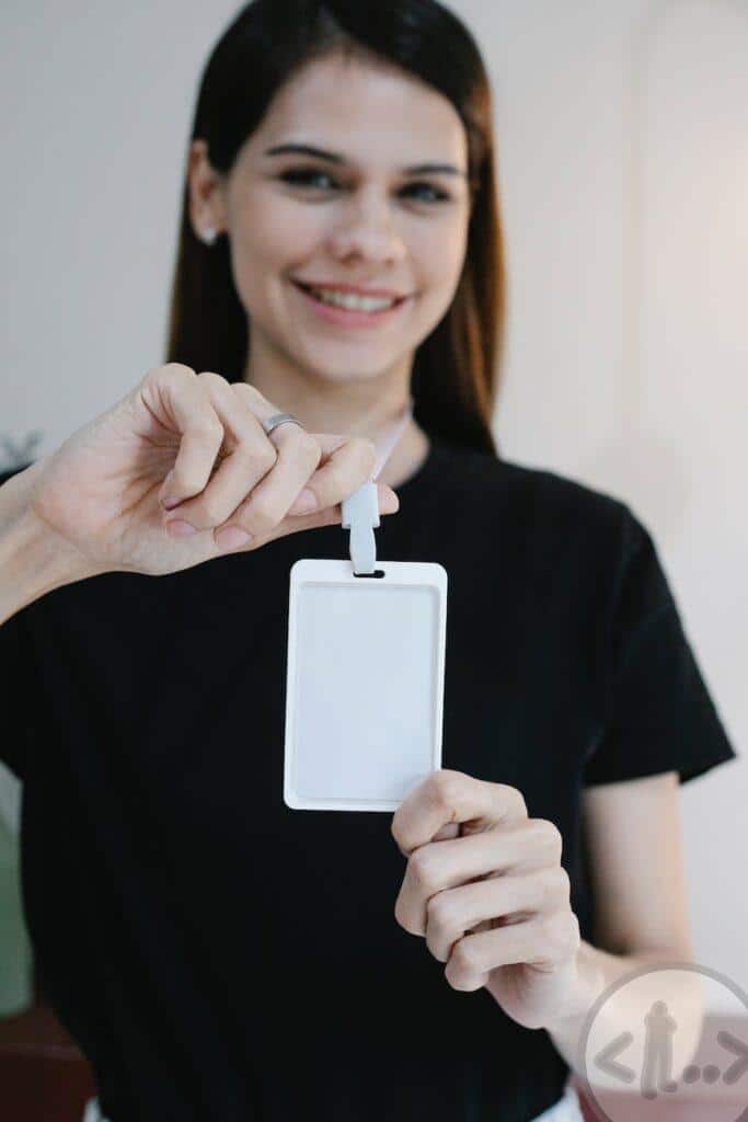 happy female demonstrating name tag