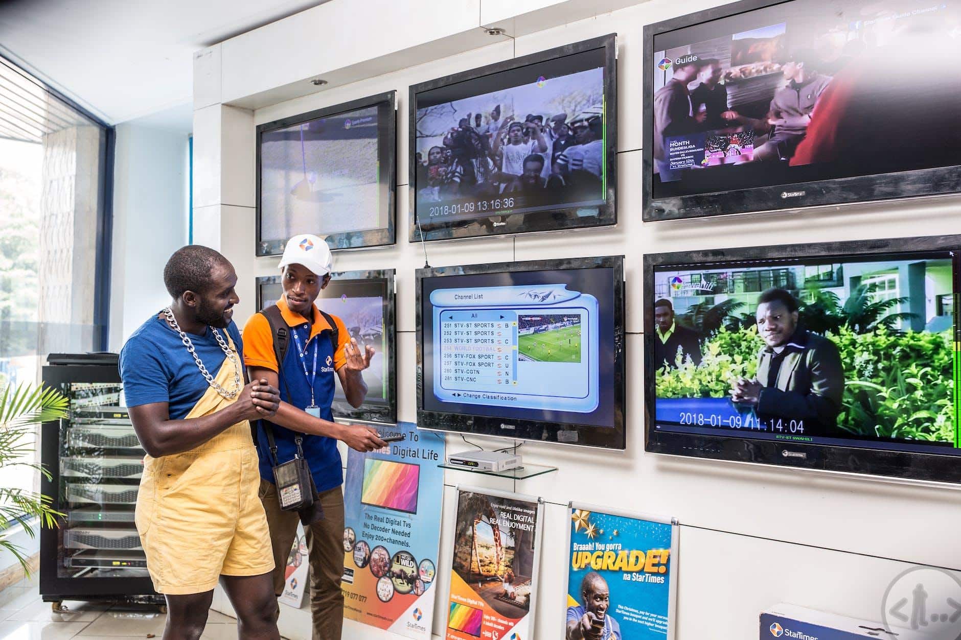 photo of a salesman selling a television to a customer