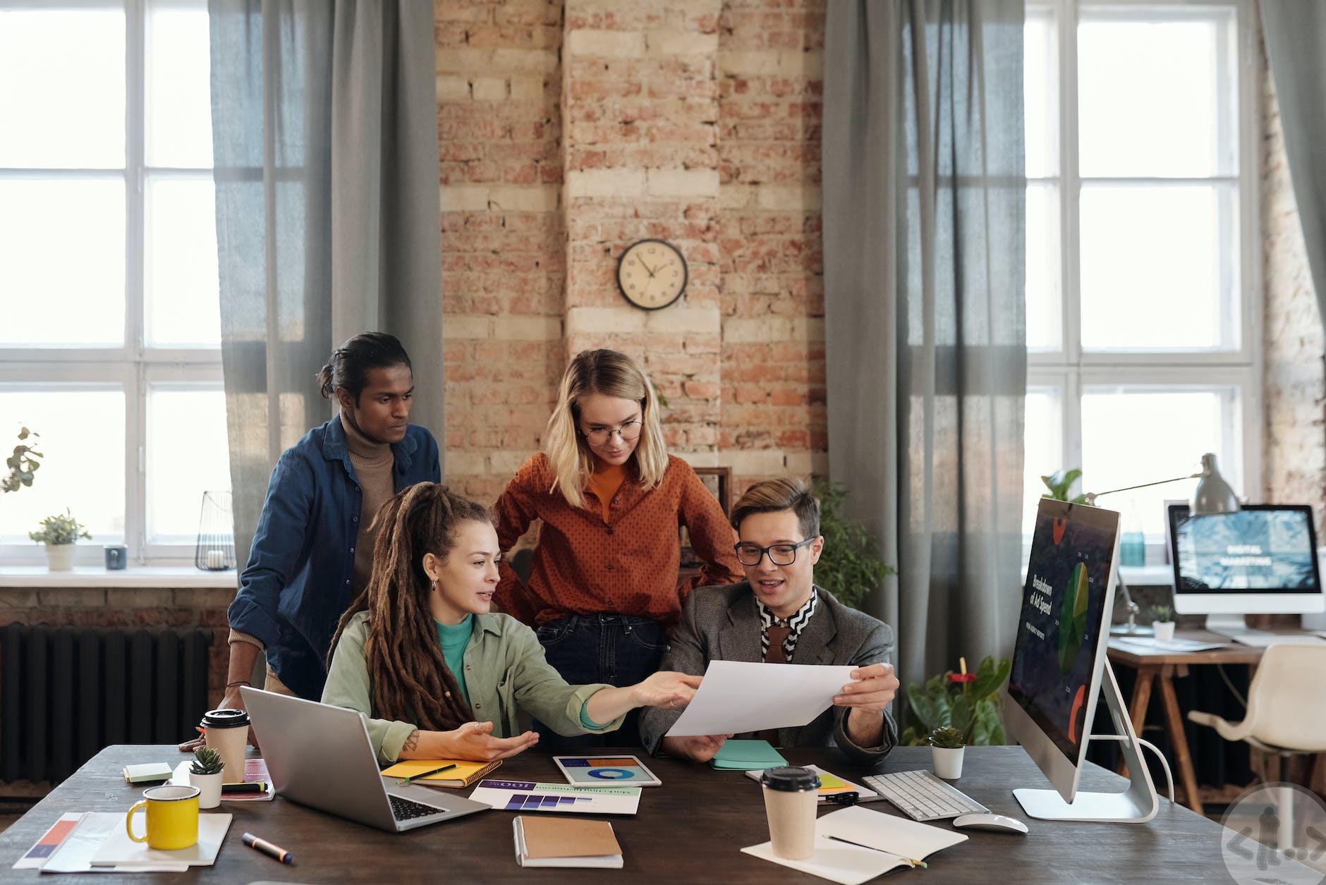 a group of people discussing marketing plans