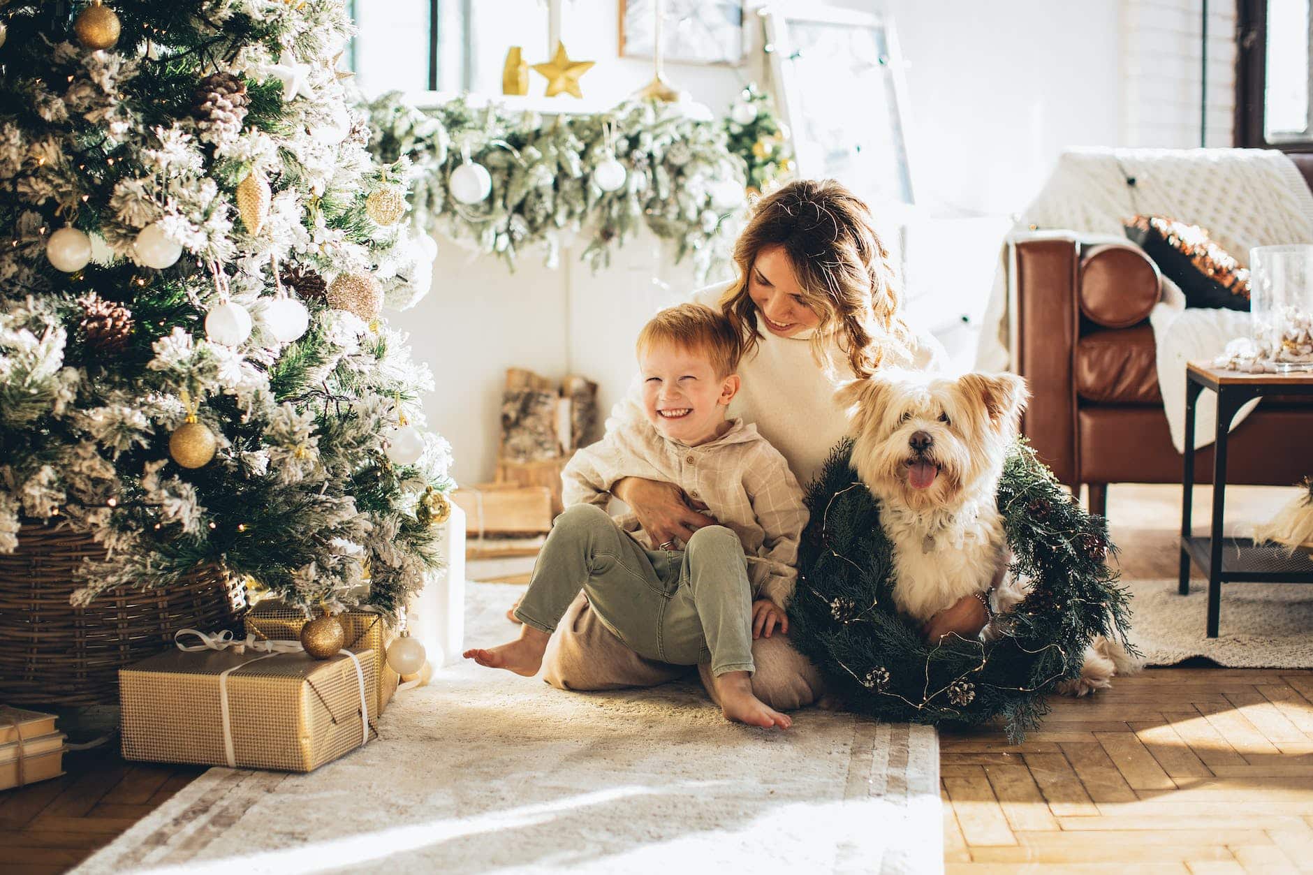 mother and son petting their dog