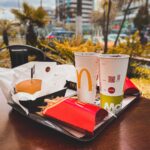 hamburger and drinks on a tray