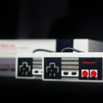 gray nintendo nes console and controllers